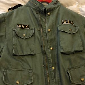 Baggy olive military jacket . Hits at hip